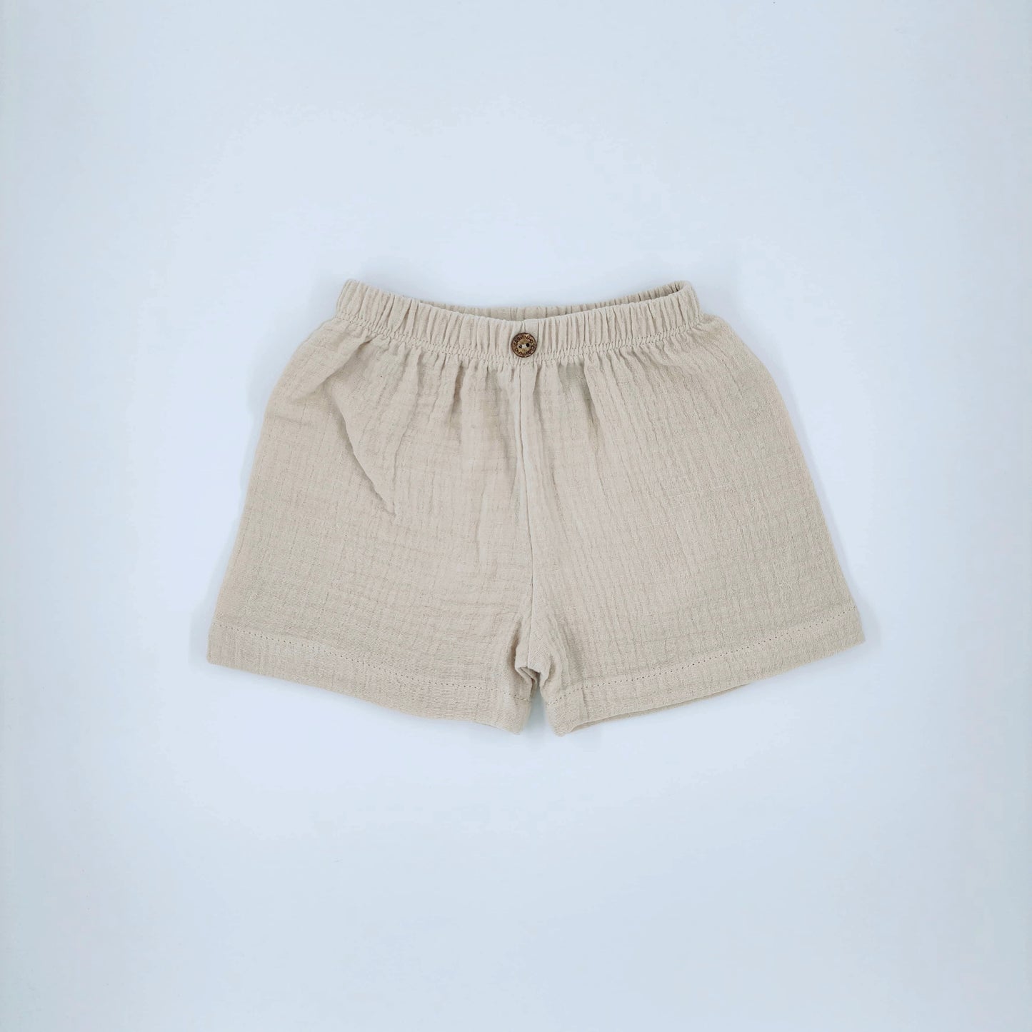 Calções, em musselina